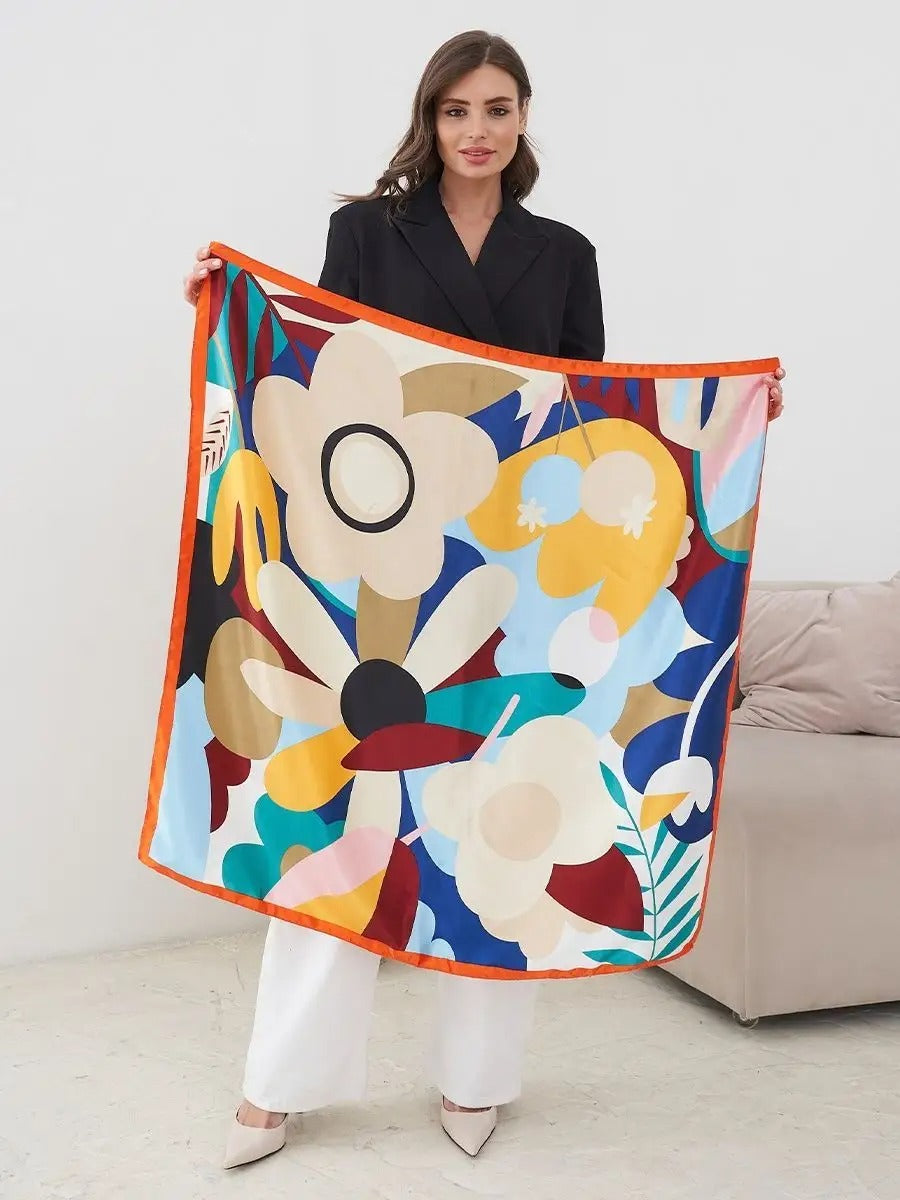 Foulard carré 70x70, soyeux au toucher, imprimé floral multicolore, bordure orange vive, accessoire mode polyvalent, modèle Kalya